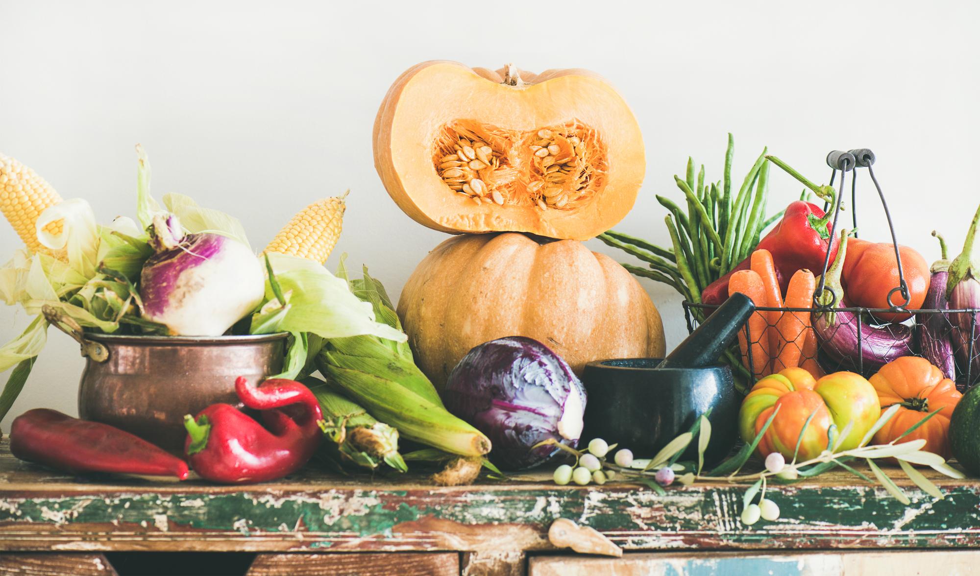 Assorted seasonal vegetables on rustic table
